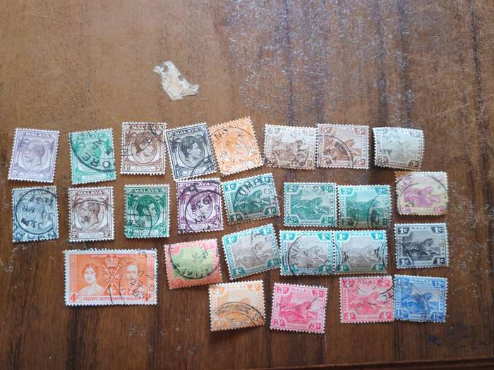 Large lot of vintage Malaya straits settlements stamps