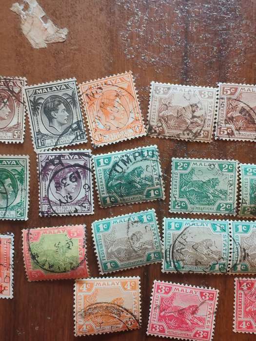 Large lot of vintage Malaya straits settlements stamps