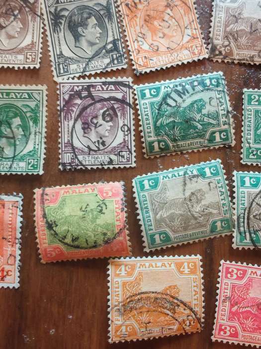 Large lot of vintage Malaya straits settlements stamps