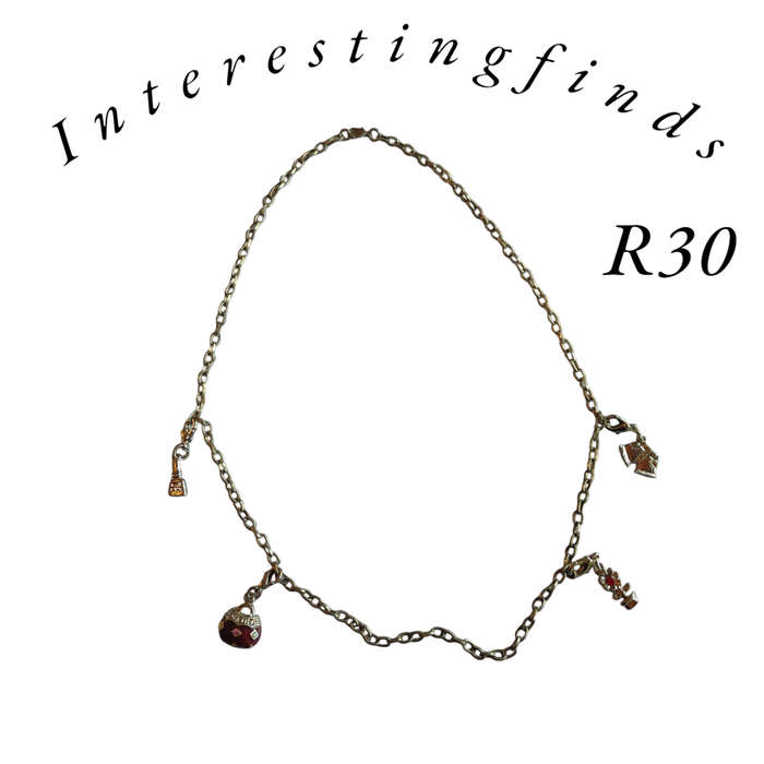 Interesting necklace with pendant charms