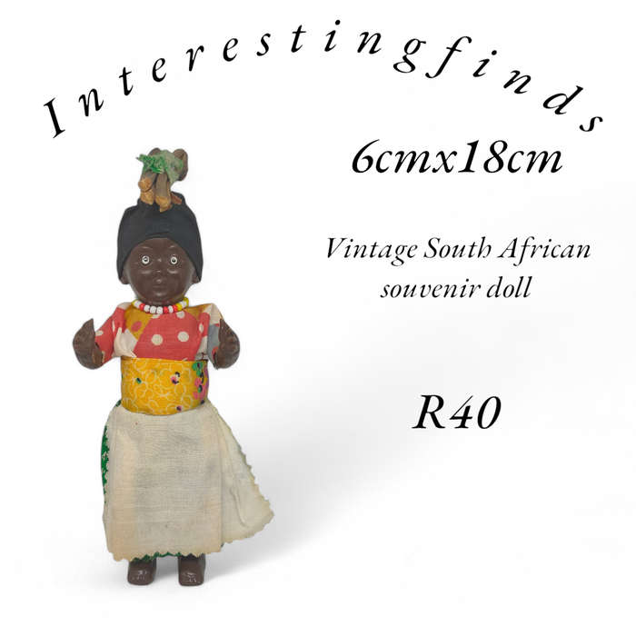Vintage South African souvenir doll with sleep eyes