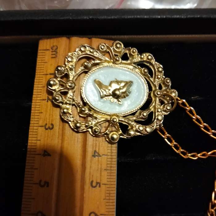 Necklace - Cameo Pendant gold tone on white metal embossed gold tone Lobster clasp metal chain