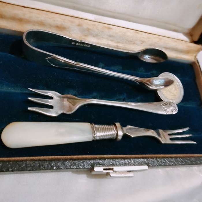 3 EPNS dinner table items 1 sugar Nips +2 pickle Forks1 MOP handle+Box for 1 bid