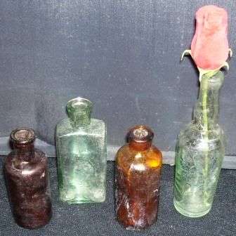 4 Small old Glass bottles