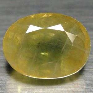 6.10 Cts.  Natural Yellow Green Sapphire - Don't let this gem get away!