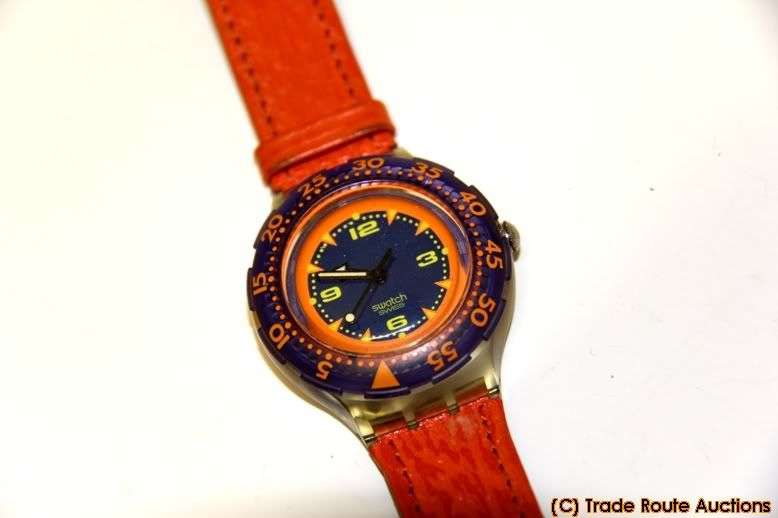SDK106 Swatch - Scuba Red Island Hands Glow Classic - Clearance SALE