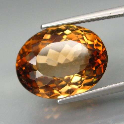GLORIOUS!!  MAGNIFICENT 13.84CT. OVAL FACET  IMPERIAL CHAMPAGNE TOPAZ