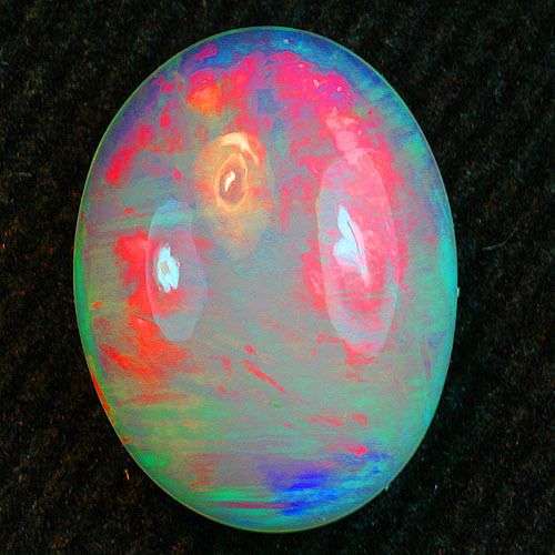 OUTSTANDING OPAL!!!  2.61CT. OVAL FACET 100% NATURAL ELECTRIC RED RAINBOW PLAY DELANTA  WELO OPAL