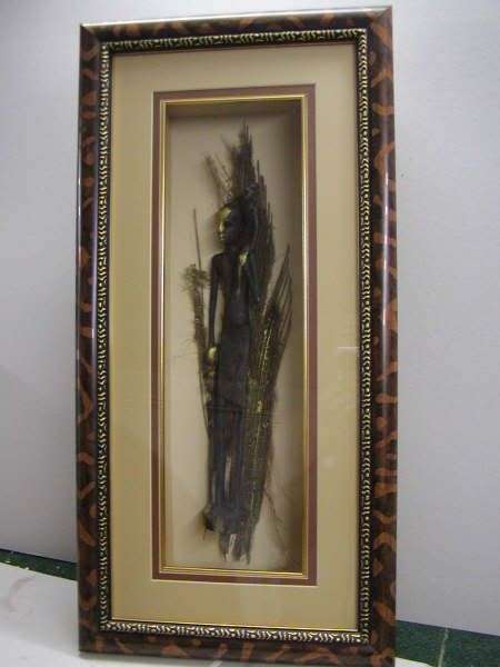 African Figure with gold highlights on palmbark