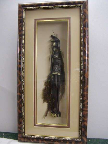 African Figure with gold highlights on palmbark