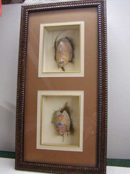 African masks on palm bark