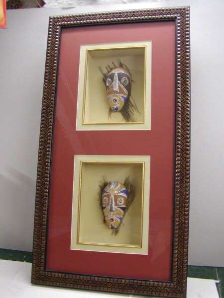 African masks on palm bark