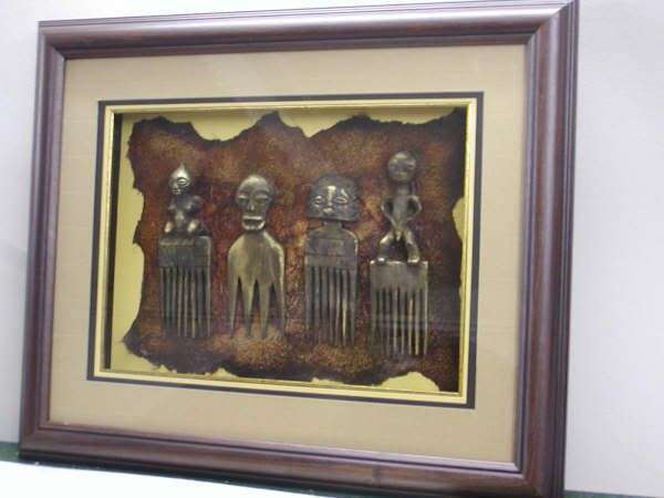 Antique African combs with gold highlights on handmade paper