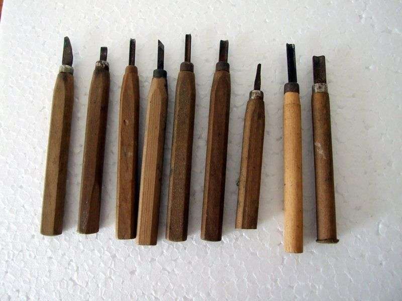 An assortment of old wood carving tools