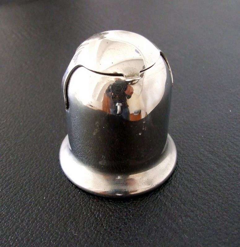 An old chrome capstan inkwell