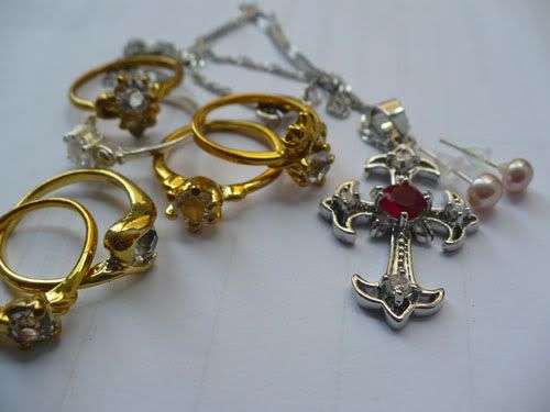 Set of 6 Rings a Gold Plated Cross Necklace and Pearl Earrings
