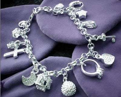 STERLING SILVER STUNNING 13 CHARM BRACELET