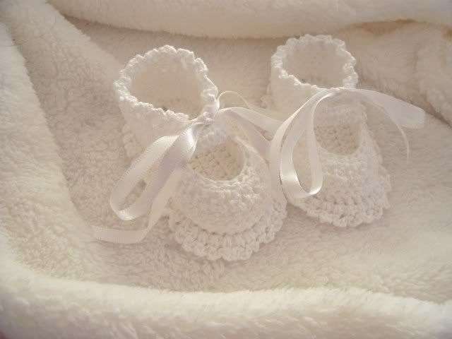 Beautiful white hand crocked baby booties