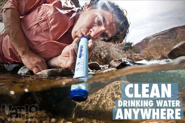 Man safely drinking water from a stream with his LifeStraw water filter.