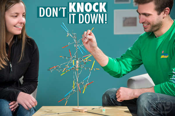 Two people playing a game of Suspend.