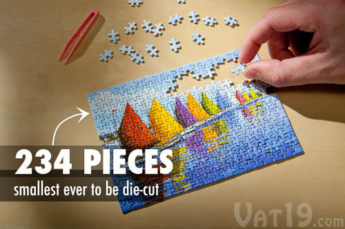 The World's Smallest Jigsaw Puzzle on a table.