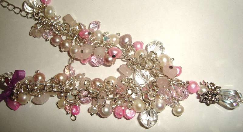 A beautiful combination of authentic pink, lavender and white freshwater pearls, swarovski crystal and rose quartz