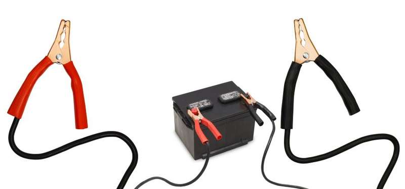 Jumper Leads Connected To Car Battery