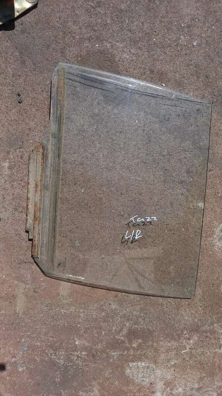 Toyota Tazz left rear door glass
