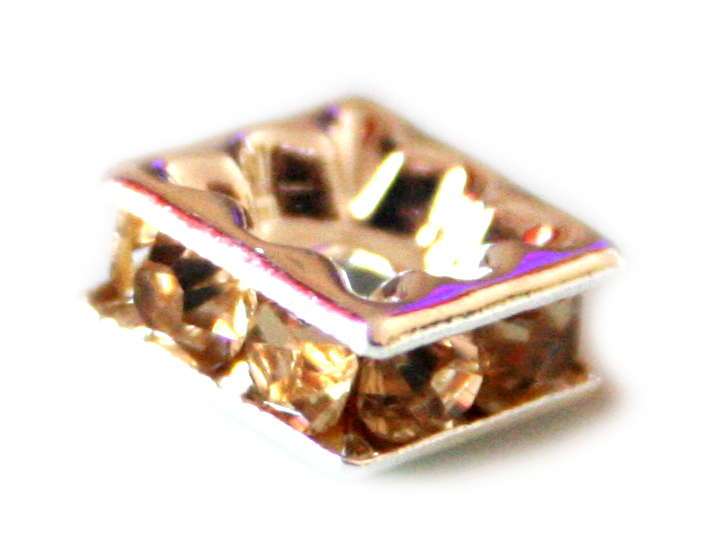 7mm square, yellow colored rondels in silver colored metal.