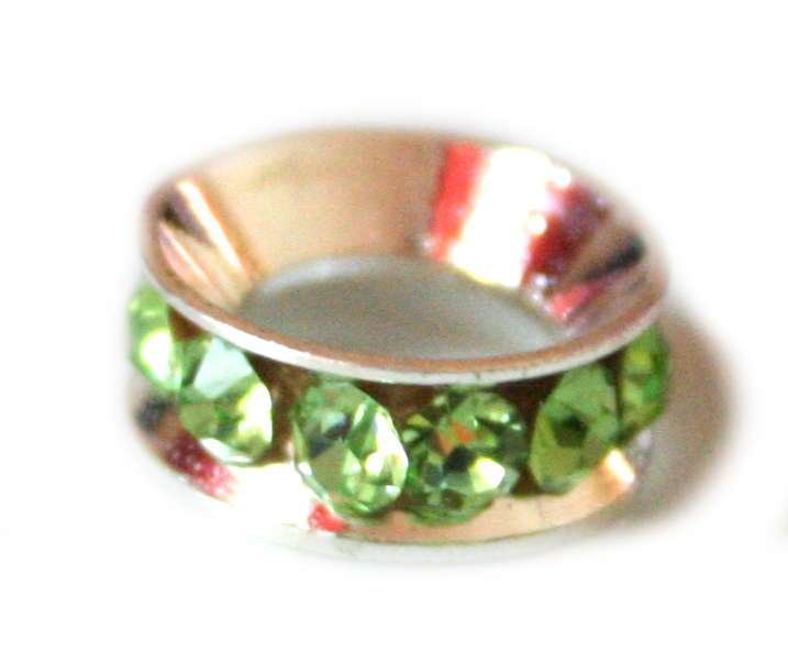 12mm Peridot colored rhinestones roundel. Silver base color.