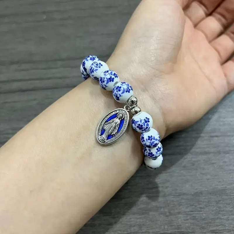 Porcelain Bracelet with delicate blue flowers and Miraculous Medal with blue inlay