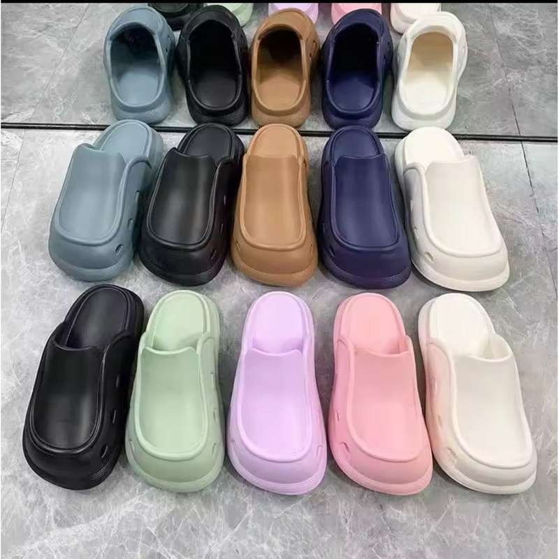 Thick bottom closed toe porous shoes.