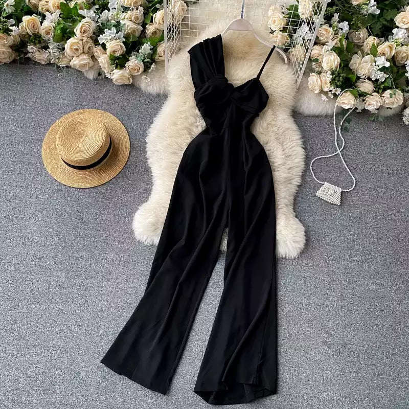 Asymmetrical off-the-shoulder twisted jumpsuit.