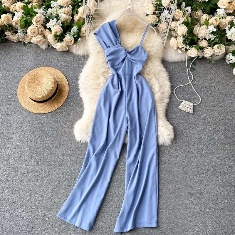 Asymmetrical off-the-shoulder twisted jumpsuit.