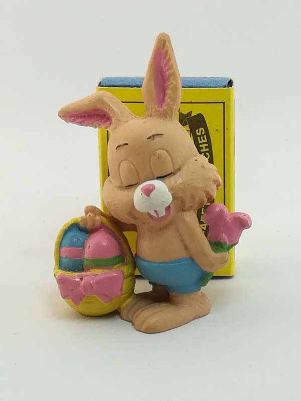 Small Bunny Rabbit Holding Easter Eggs in Basket