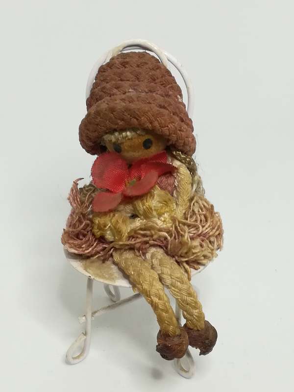 Small Wooden Brown Doll on Chair