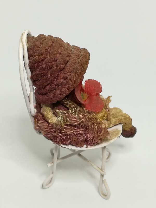 Small Wooden Brown Doll on Chair