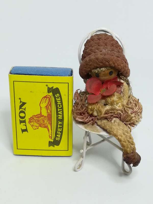 Small Wooden Brown Doll on Chair