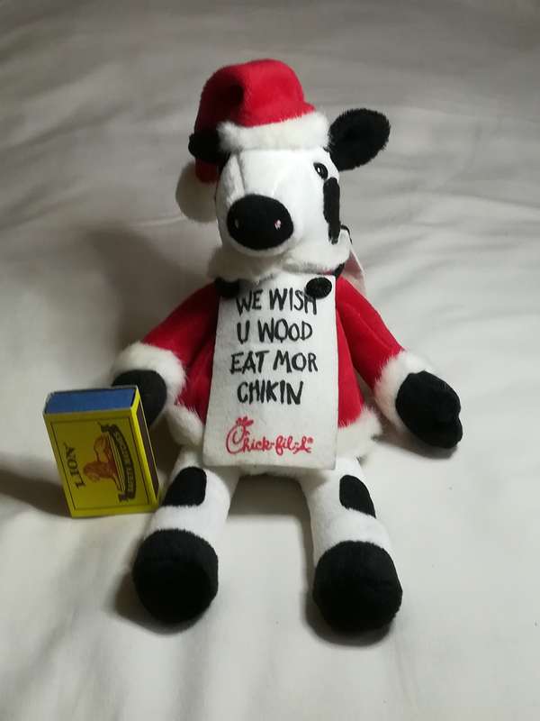 Black & White Cow Dressed in Father Christmas Suit
