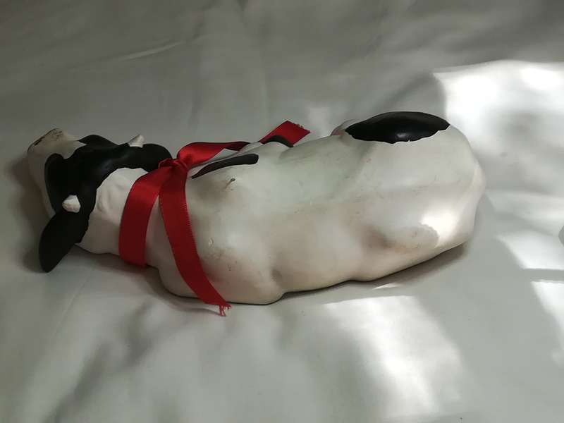 Black & White Ceramic Cow with Red Ribbon Around The Neck