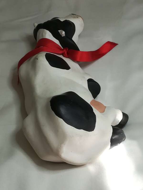 Black & White Ceramic Cow with Red Ribbon Around The Neck