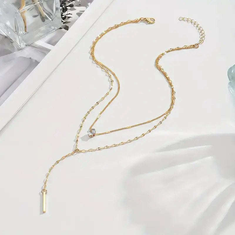 Multi Layered Gold Tone Necklace with White Gemstone