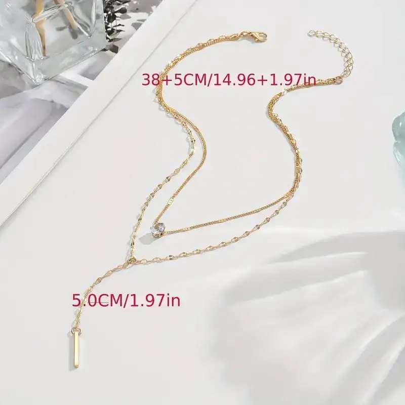 Multi Layered Gold Tone Necklace with White Gemstone