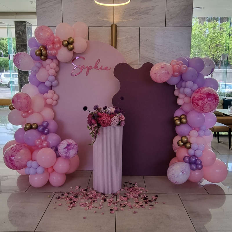 PINK AND PURPLE Double Chiara Backdrop with Organic Balloon Garland and Plinth