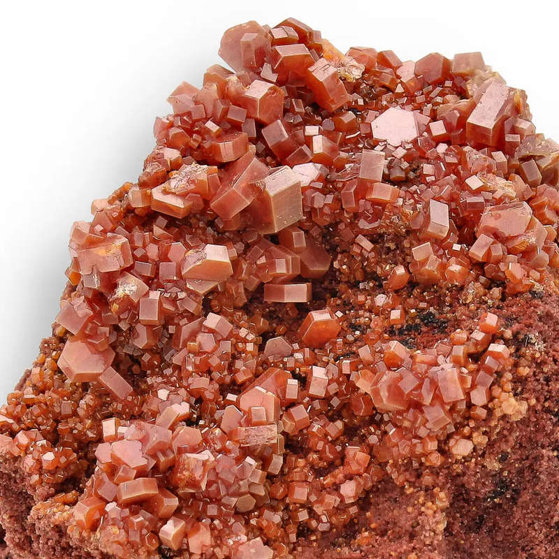 Vanadinite Flame: Lustrous Red Hexagons from Morocco