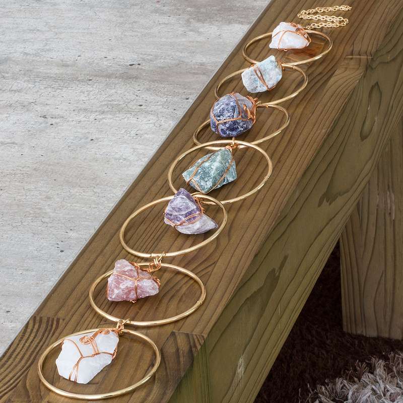 Rough natural stone, wire wrapped, iron ring wall art
