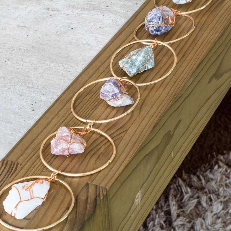 Rough natural stone, wire wrapped, iron ring wall art