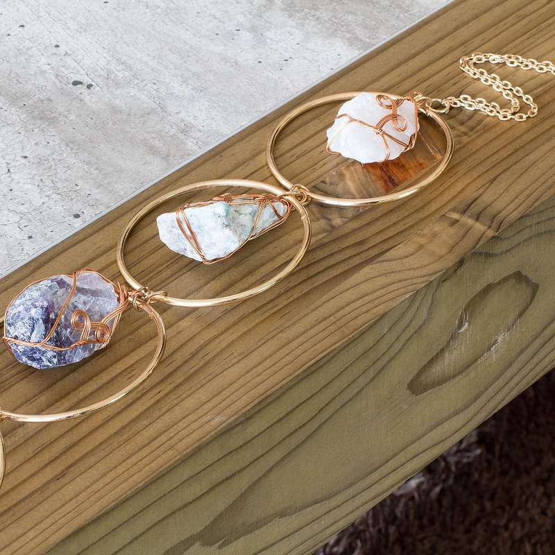 Rough natural stone, wire wrapped, iron ring wall art