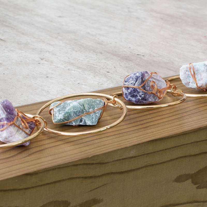 Rough natural stone, wire wrapped, iron ring wall art