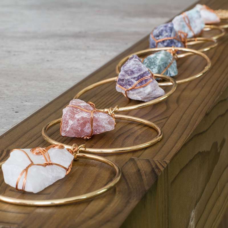 Rough natural stone, wire wrapped, iron ring wall art
